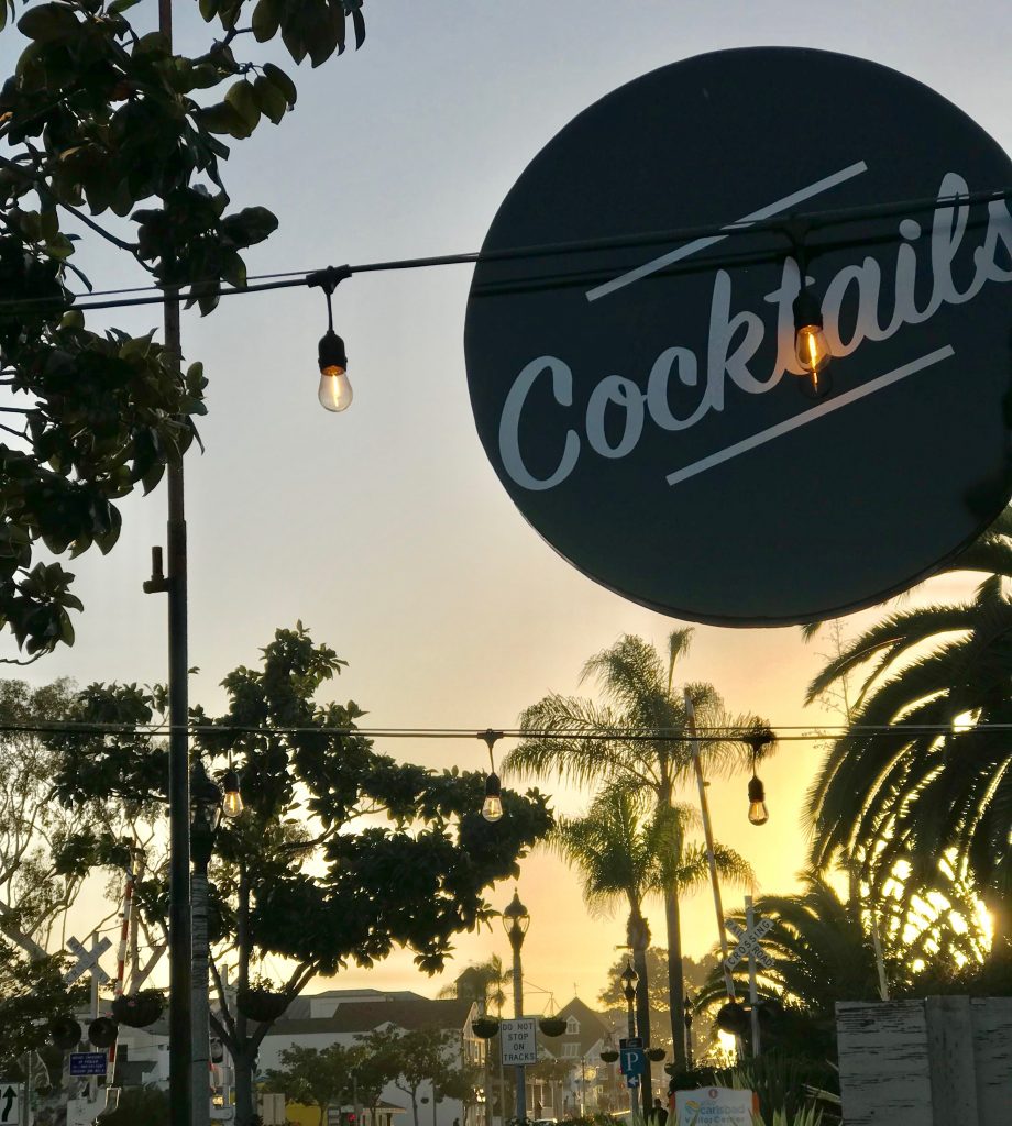 A Retro Vintage Cocktail Sign Hangs In The Village With Bistro Lights T20 8Dvykv - California Locals