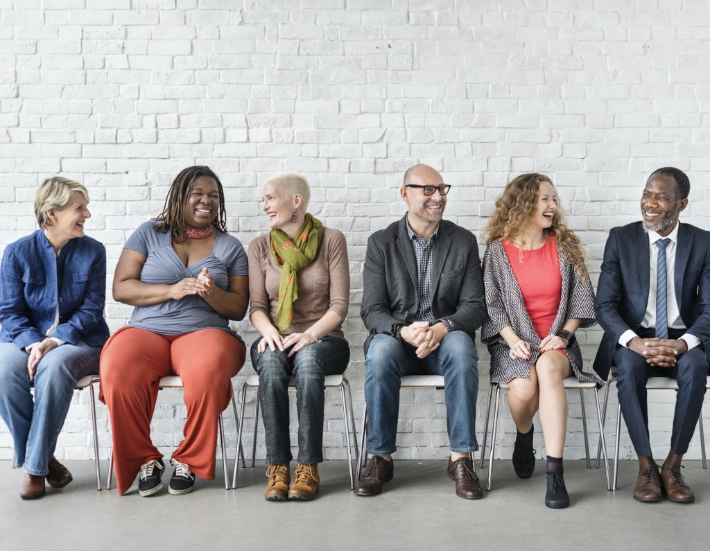 Diverse Group Of People Community Togetherness Sitting Concept