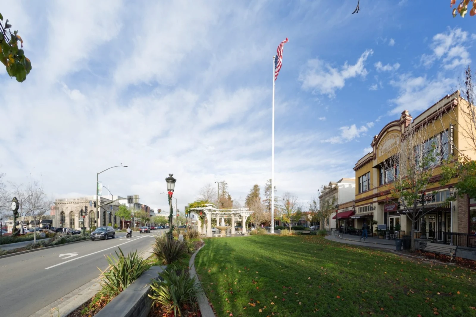 A tree-lined downtown street and buildings in Livermore.